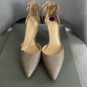 Jessica Simpson Gold/ Silver Heels with bow on back. Size 8.5. Worn once.